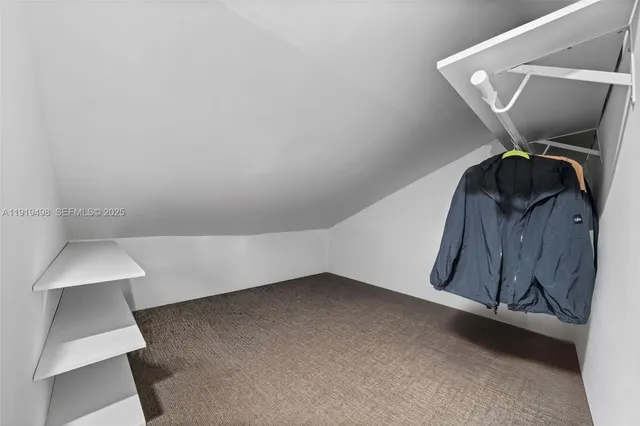 a view of a hallway with stairs