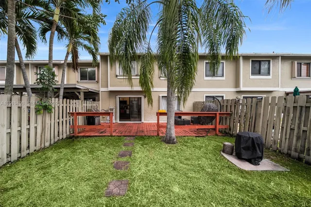 a view of outdoor space with deck and furniture