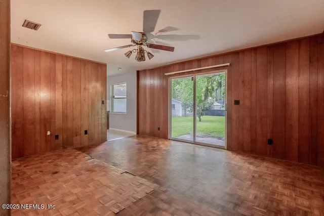 a view of an empty room with a window