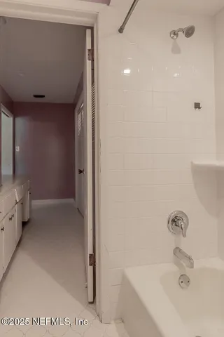 a bathroom with a sink and shower