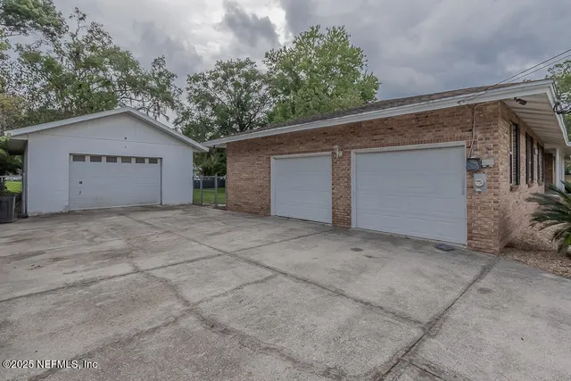 a view of garage and yard