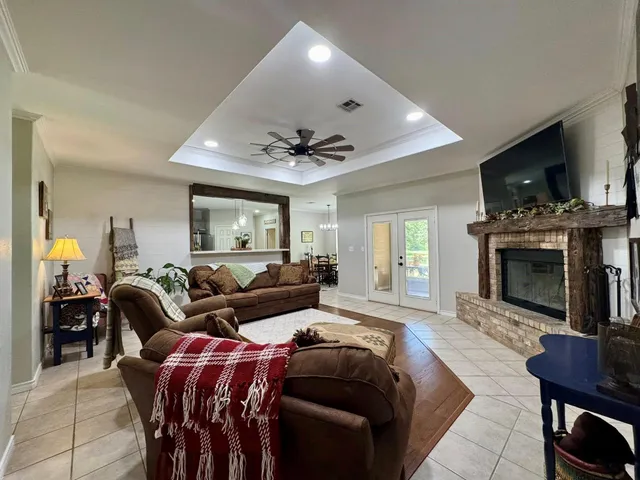 a living room with furniture and a fireplace