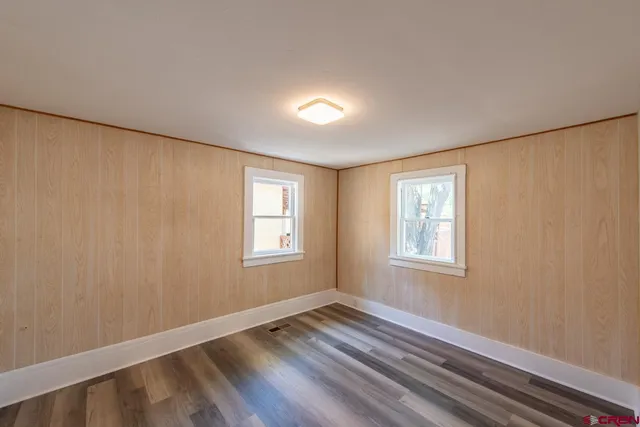 a bathroom with a bathtub shower sink vanity and a toilet