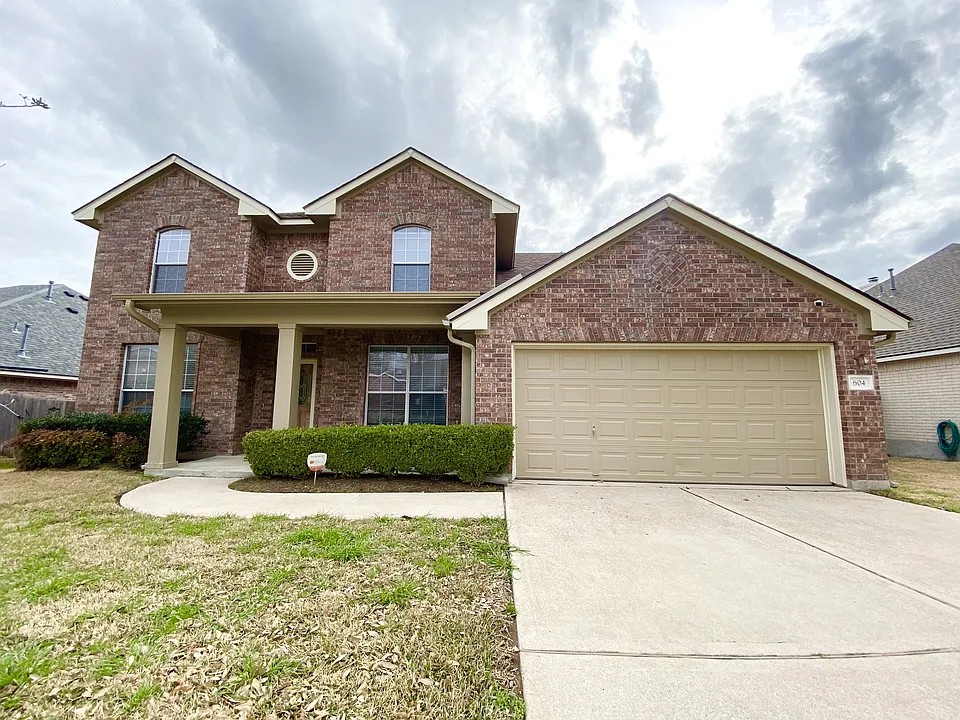front view of a house and a yard