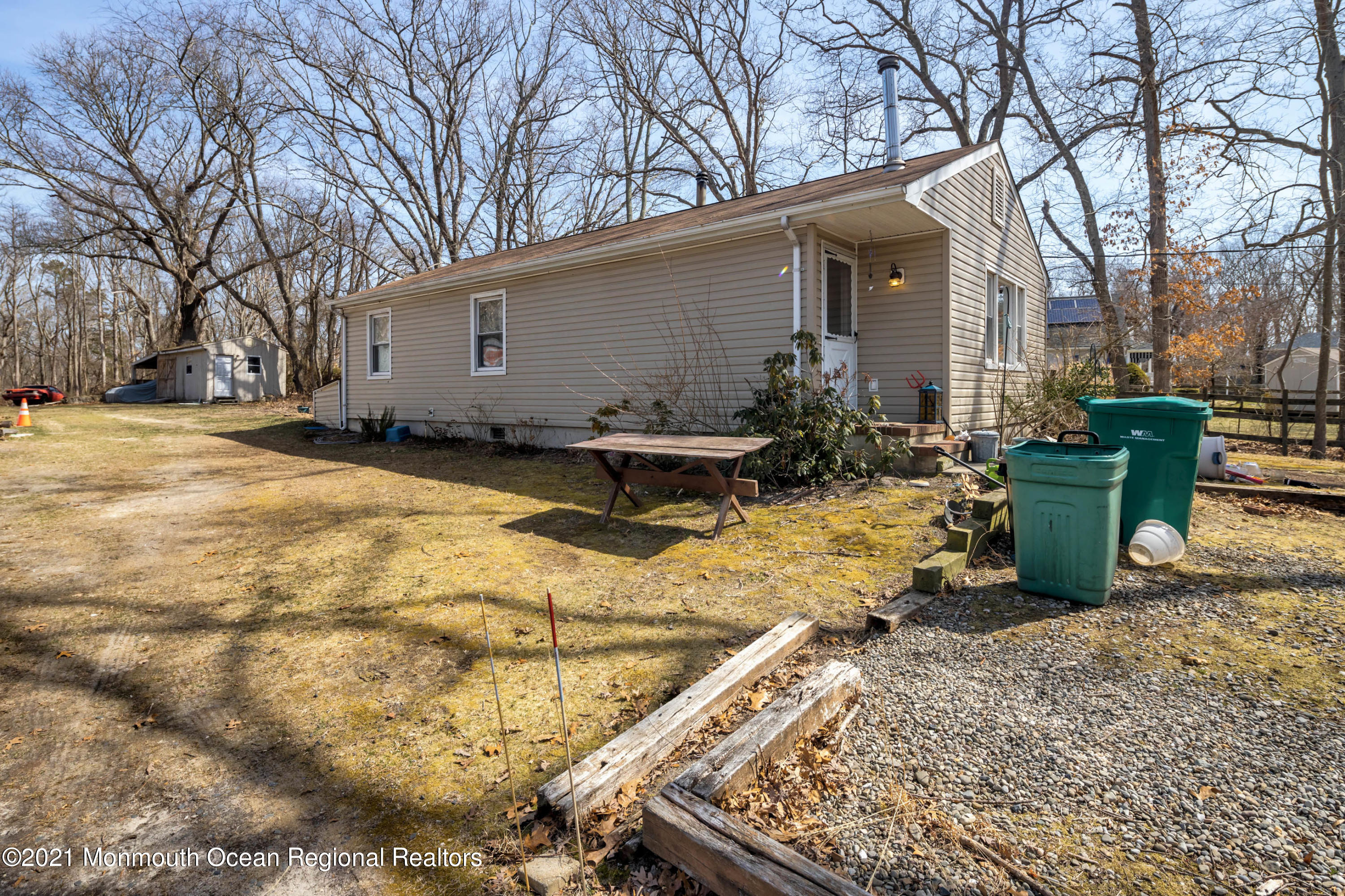 77 Maxim Road Howell, NJ 07731 - Photo 1 of 5 a view of a backyard with chairs