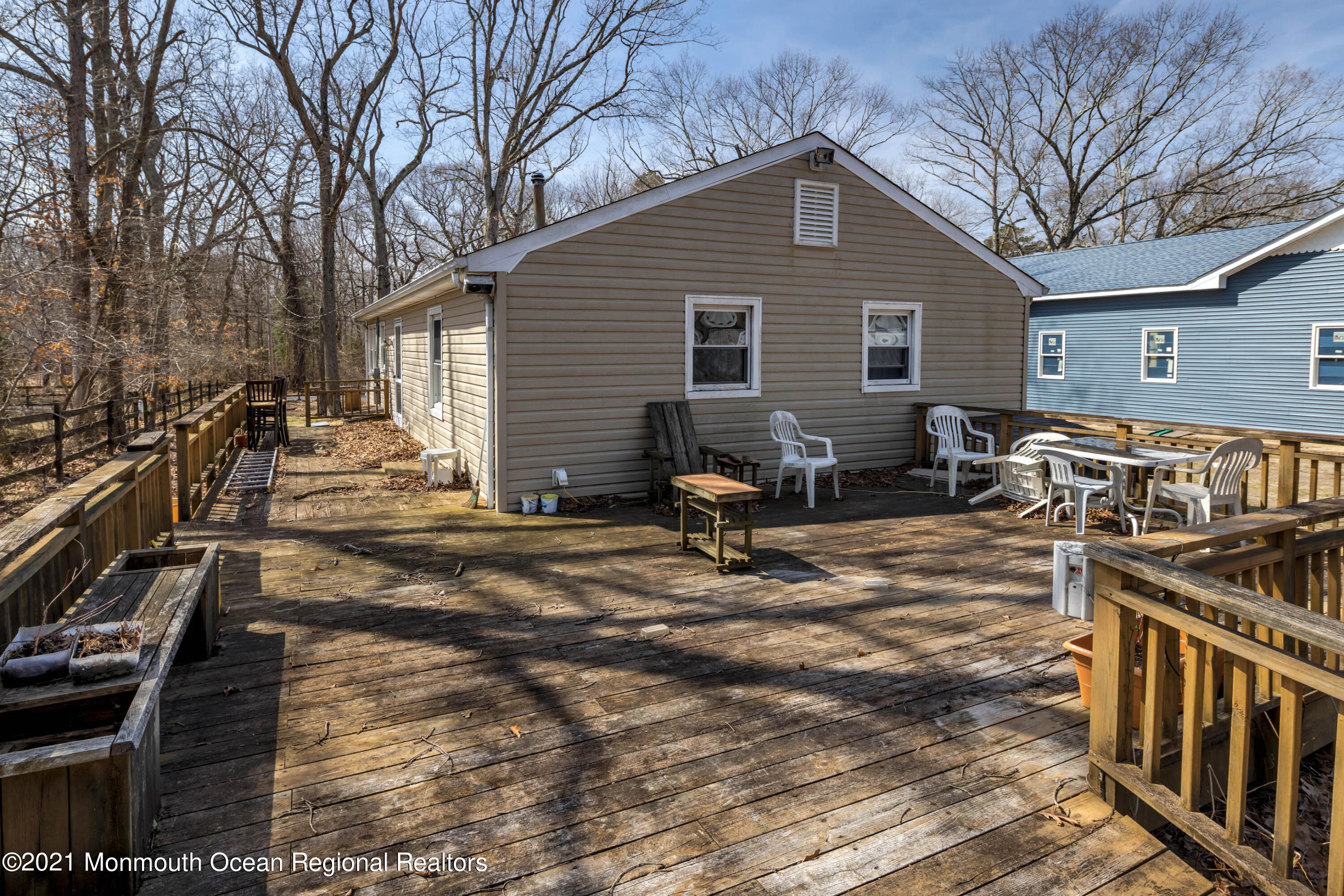 77 Maxim Road Howell, NJ 07731 - Photo 2 of 5 a view of a house with chairs and wooden fence