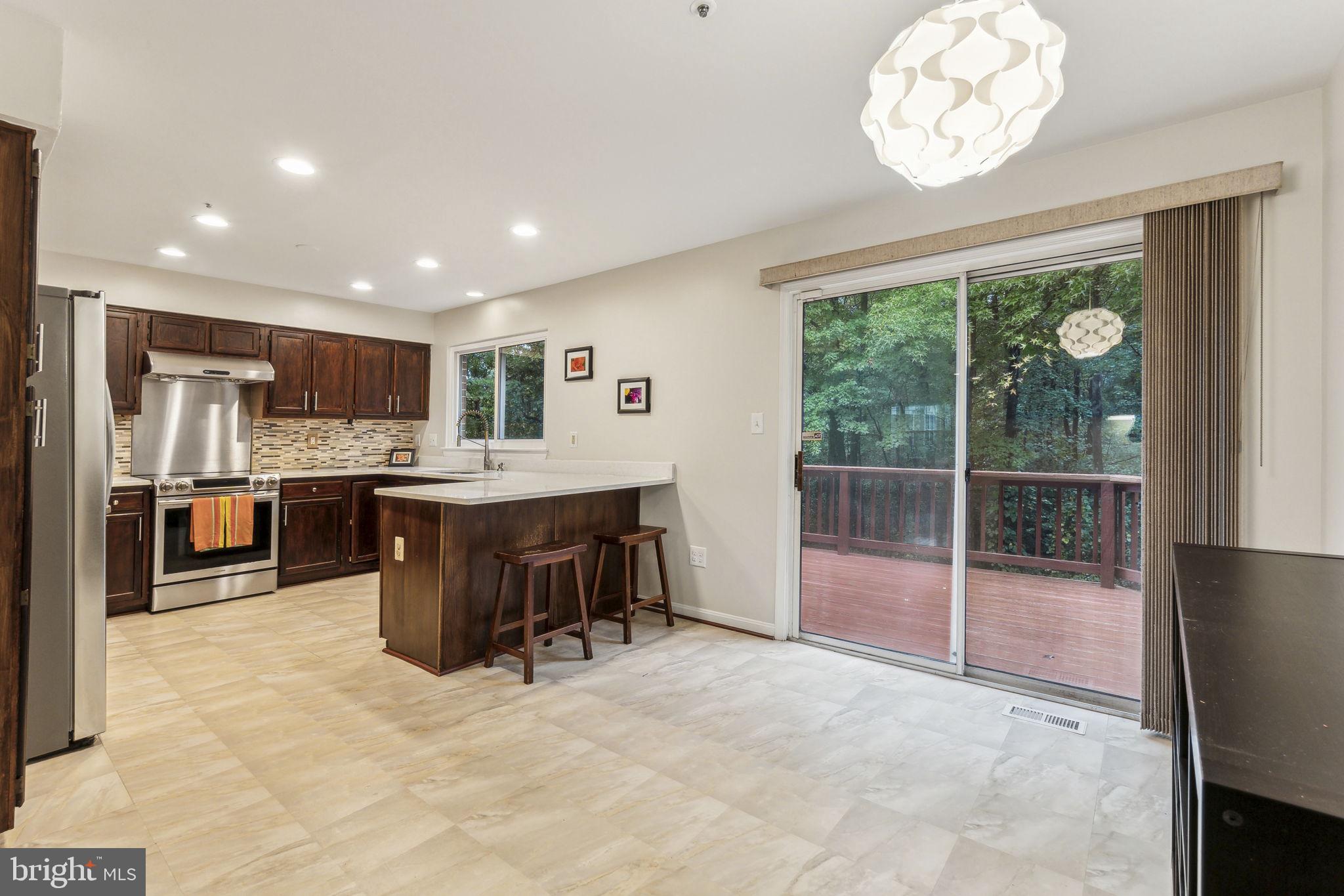 9212 Vanfleet Court Laurel, MD 20708 - Photo 18 of 46 Updated kitchen with quartz counters