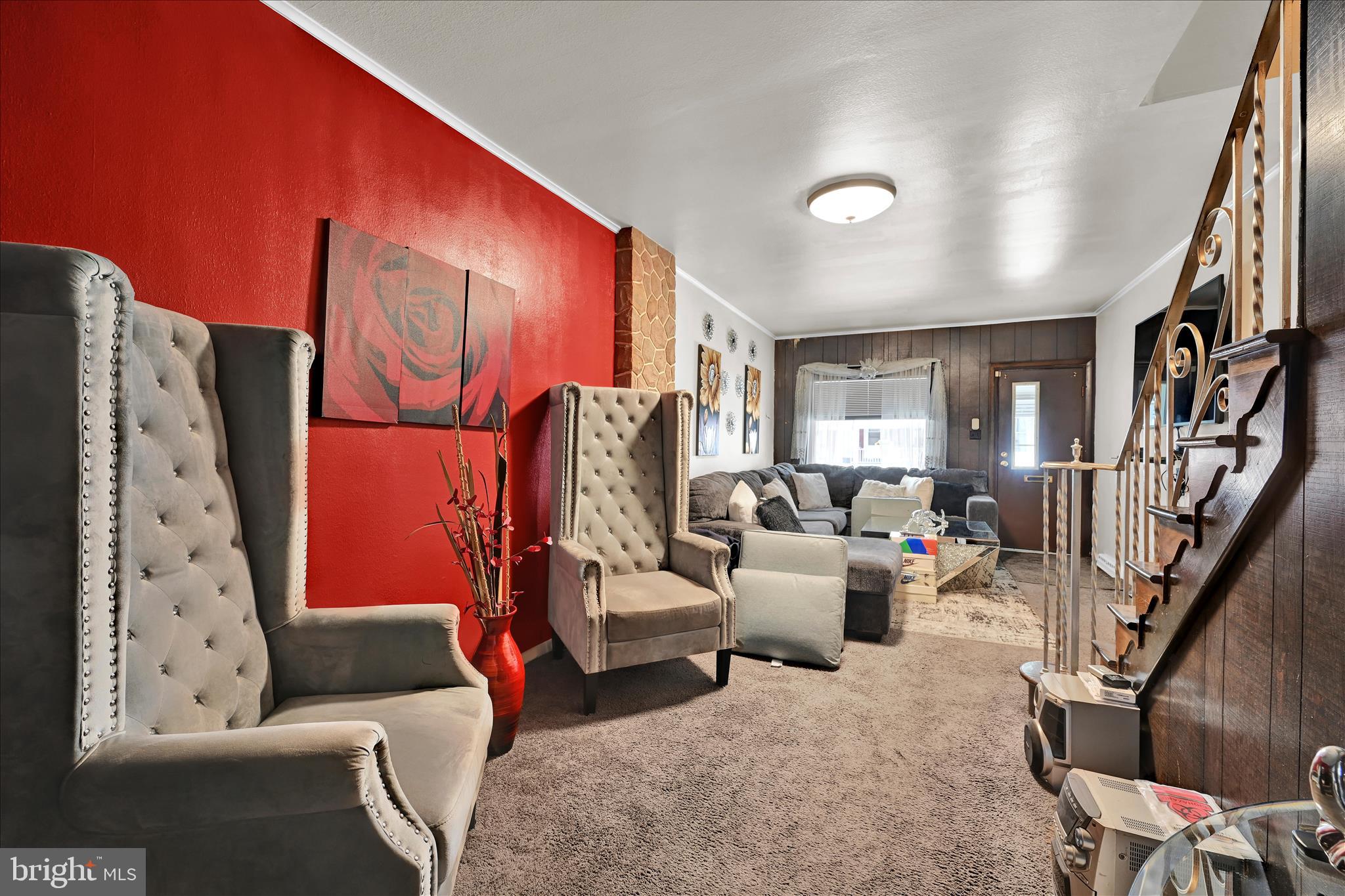 936 Pike Street Reading, PA 19604 - Photo 8 of 24 a living room with furniture a rug and a potted plant