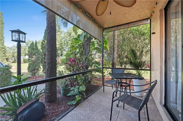 a view of a chair and table in the balcony
