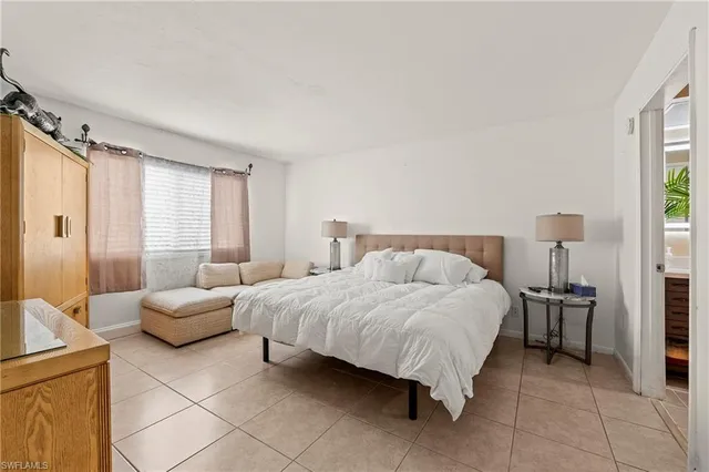 a bedroom with a bed and furniture