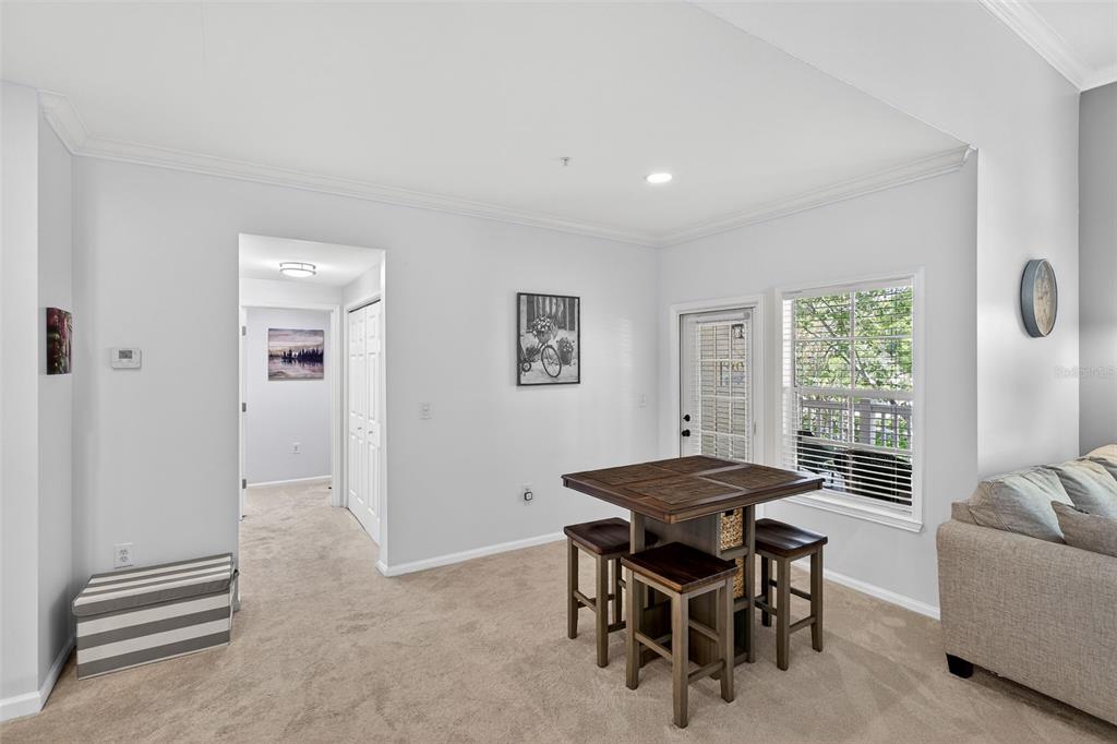 512 Water Street, Unit 512 Celebration, FL 34747 - Photo 13 of 46 a dining room with furniture and window