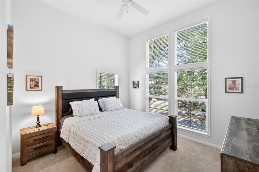 512 Water Street, Unit 512 Celebration, FL 34747 - Photo 15 of 46 a bedroom with a bed and a window
