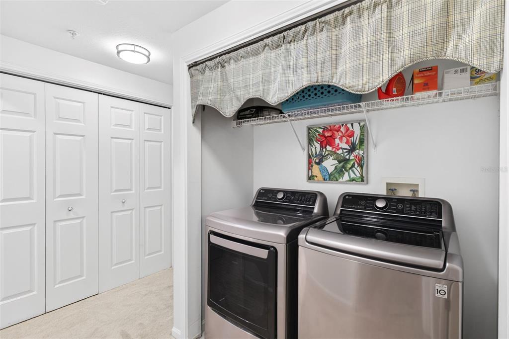 512 Water Street, Unit 512 Celebration, FL 34747 - Photo 20 of 46 a utility room with dryer and washer