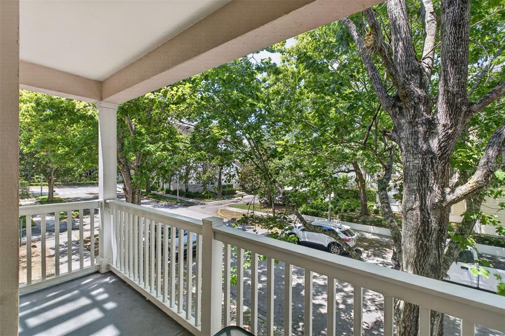 512 Water Street, Unit 512 Celebration, FL 34747 - Photo 24 of 46 a view of a balcony with trees