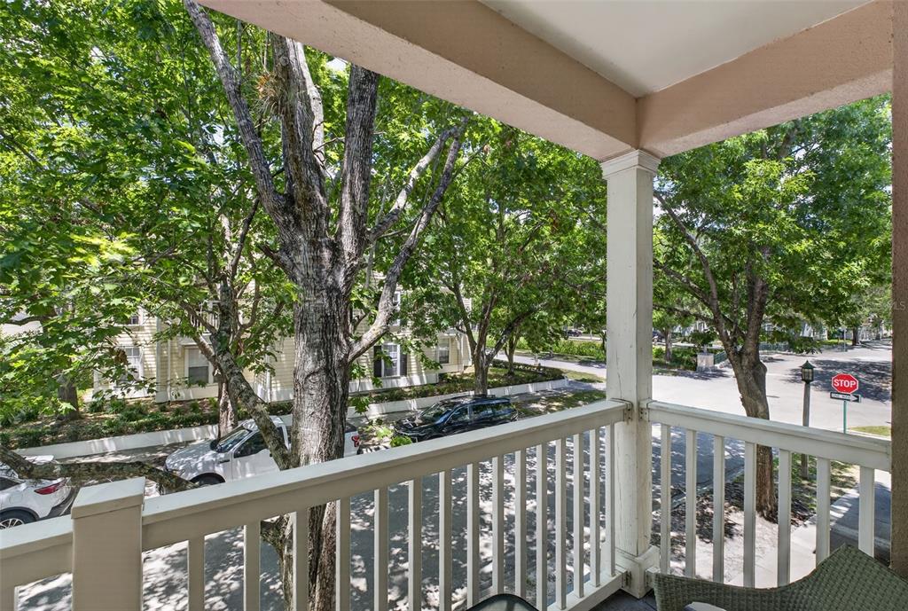 512 Water Street, Unit 512 Celebration, FL 34747 - Photo 27 of 46 a view of a wooden deck next to a yard
