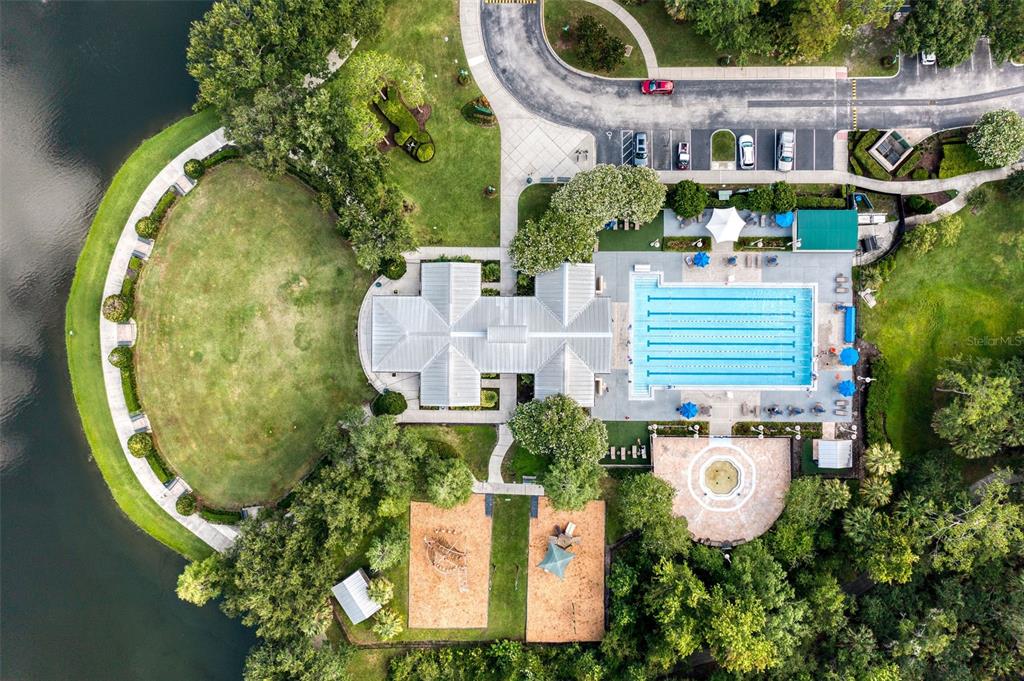 512 Water Street, Unit 512 Celebration, FL 34747 - Photo 34 of 46 an aerial view of a house with swimming pool and outdoor seating