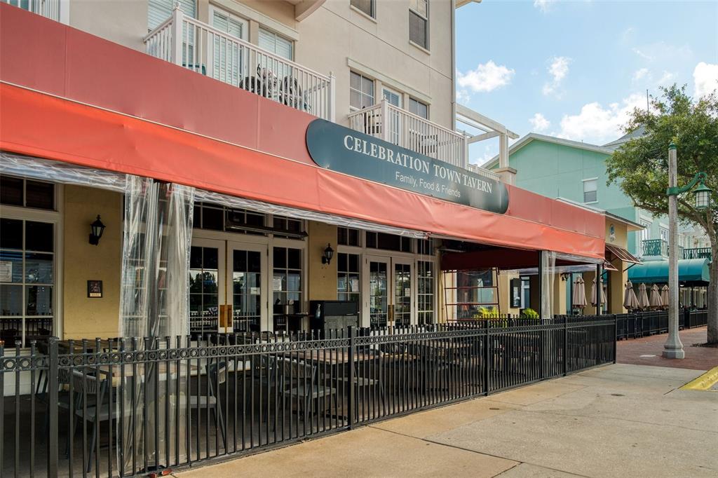 512 Water Street, Unit 512 Celebration, FL 34747 - Photo 38 of 46 a view of a building with a porch