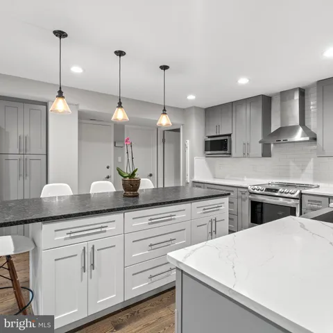 a bedroom with a large bed and a desk