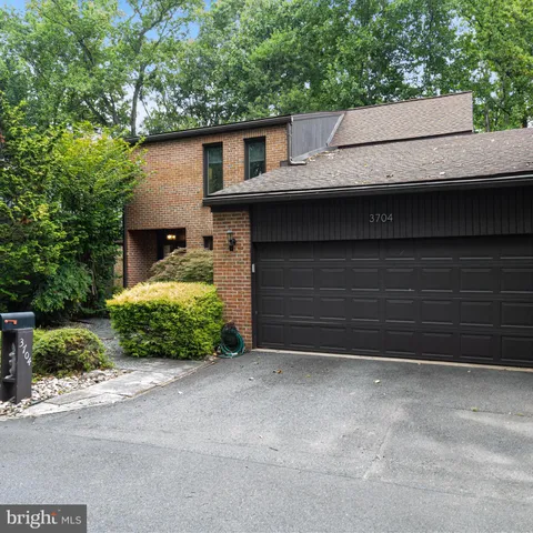a front view of a house with a garage