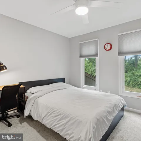 a view of a bedroom with closet and cabinet