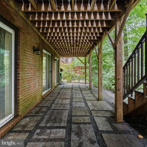 a view of a brick house with wooden walls