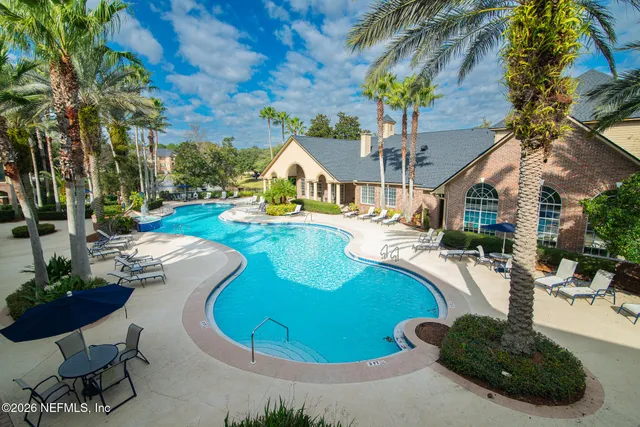 a view of a swimming pool with a patio