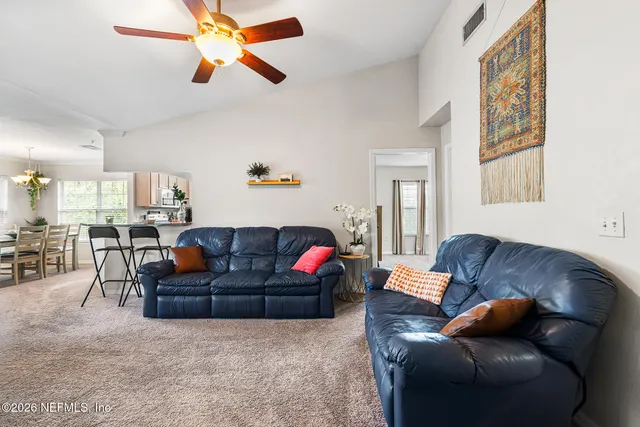 a living room with furniture and a window