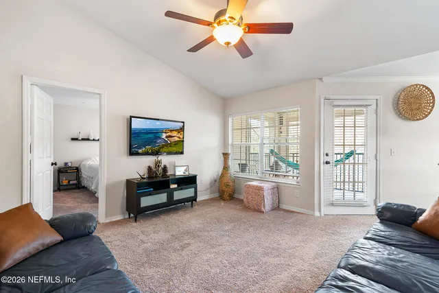 a living room with furniture and a window
