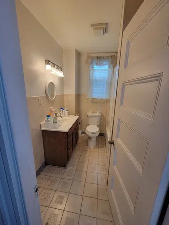 a bathroom with a sink vanity and a mirror