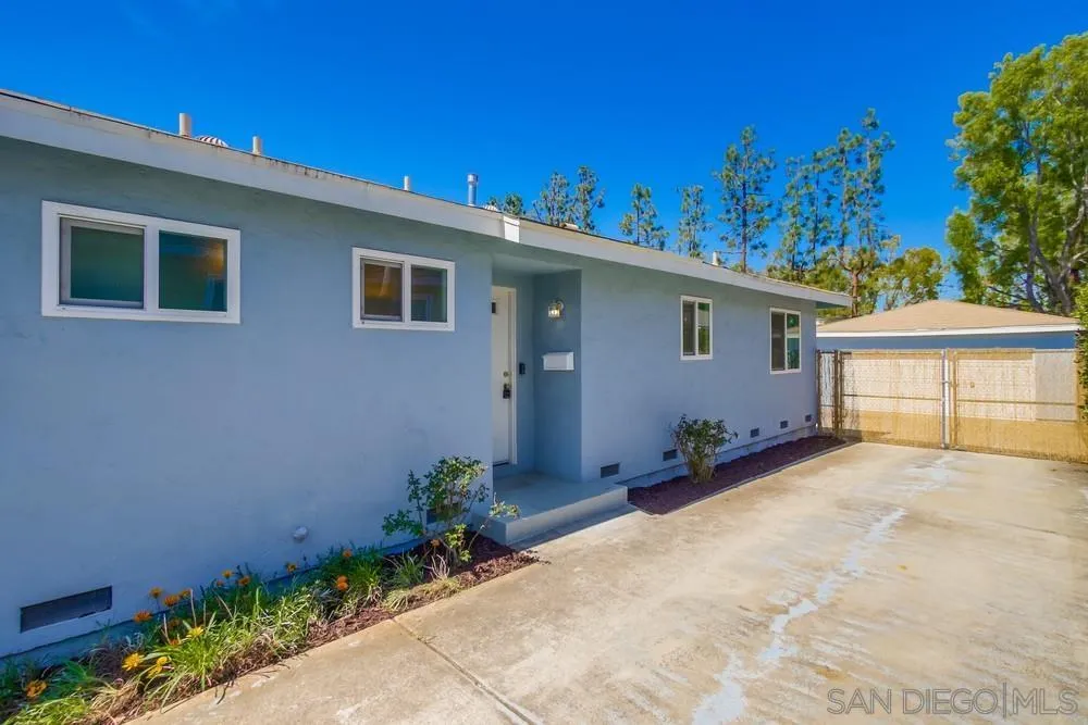 7568 Ohio Place La Mesa, CA 91942 - Photo 2 of 32 a backyard of a house with plants and trees