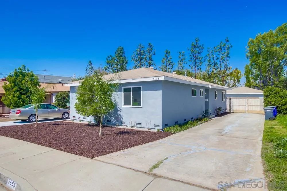 7568 Ohio Place La Mesa, CA 91942 - Photo 6 of 32 a front view of a house with a yard and garage