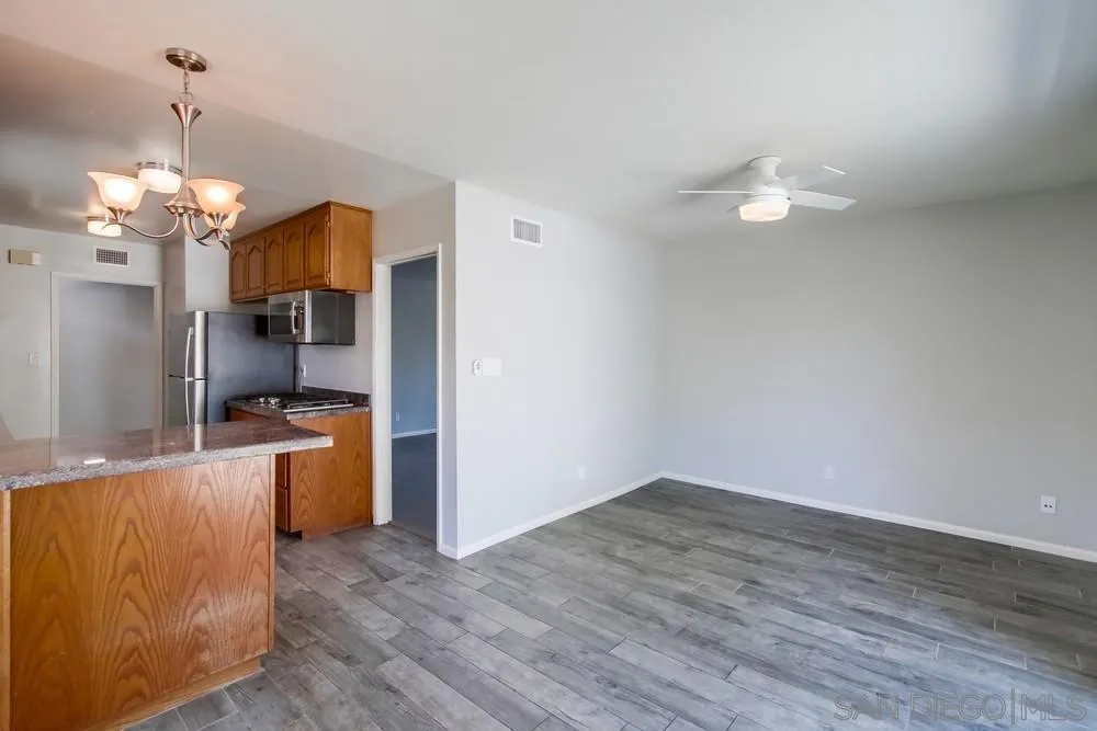 7568 Ohio Place La Mesa, CA 91942 - Photo 10 of 32 a view of a kitchen with wooden floor and a kitchen