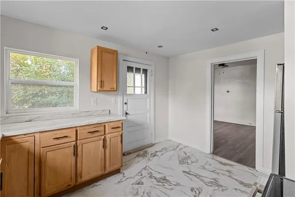 a spacious bathroom with a sink and a mirror
