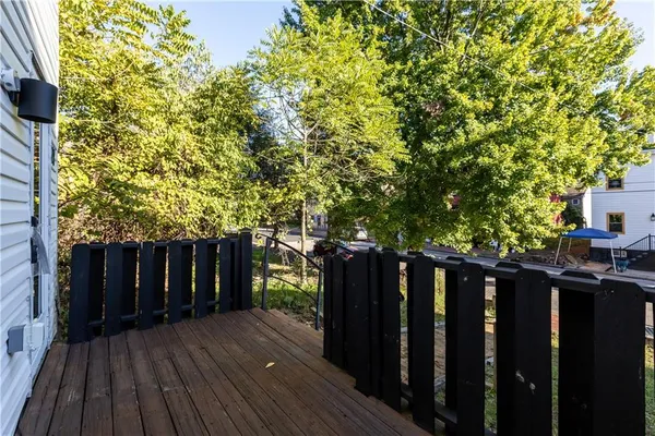 a view of deck with wooden floor and wooden fence