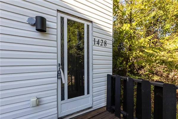 a view of front door and wooden door