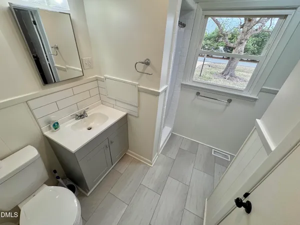 a bathroom with a sink toilet and tub