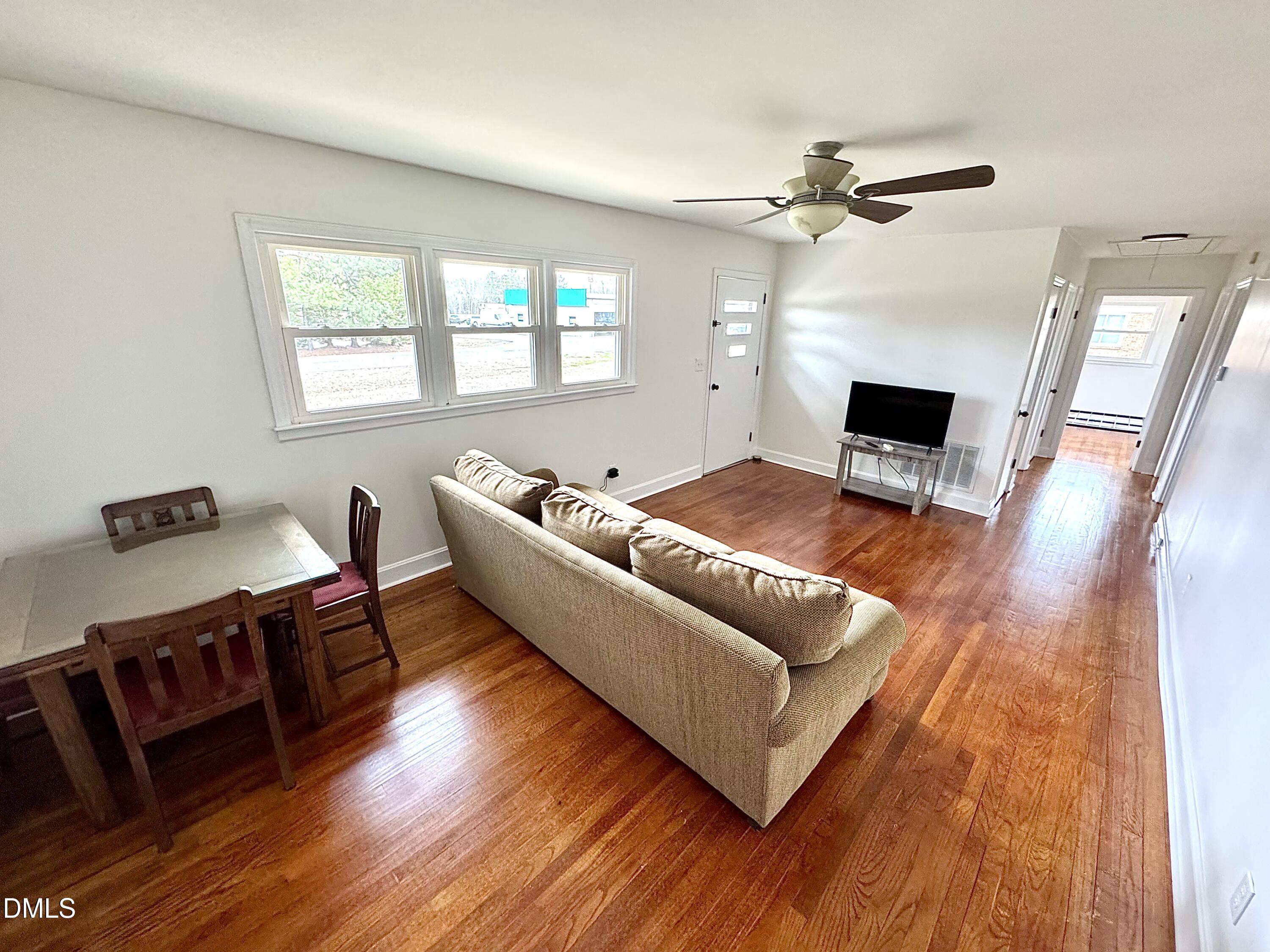 30 Nandina Drive Roxboro, NC 27573 - Photo 14 of 31 a living room with furniture and a fireplace