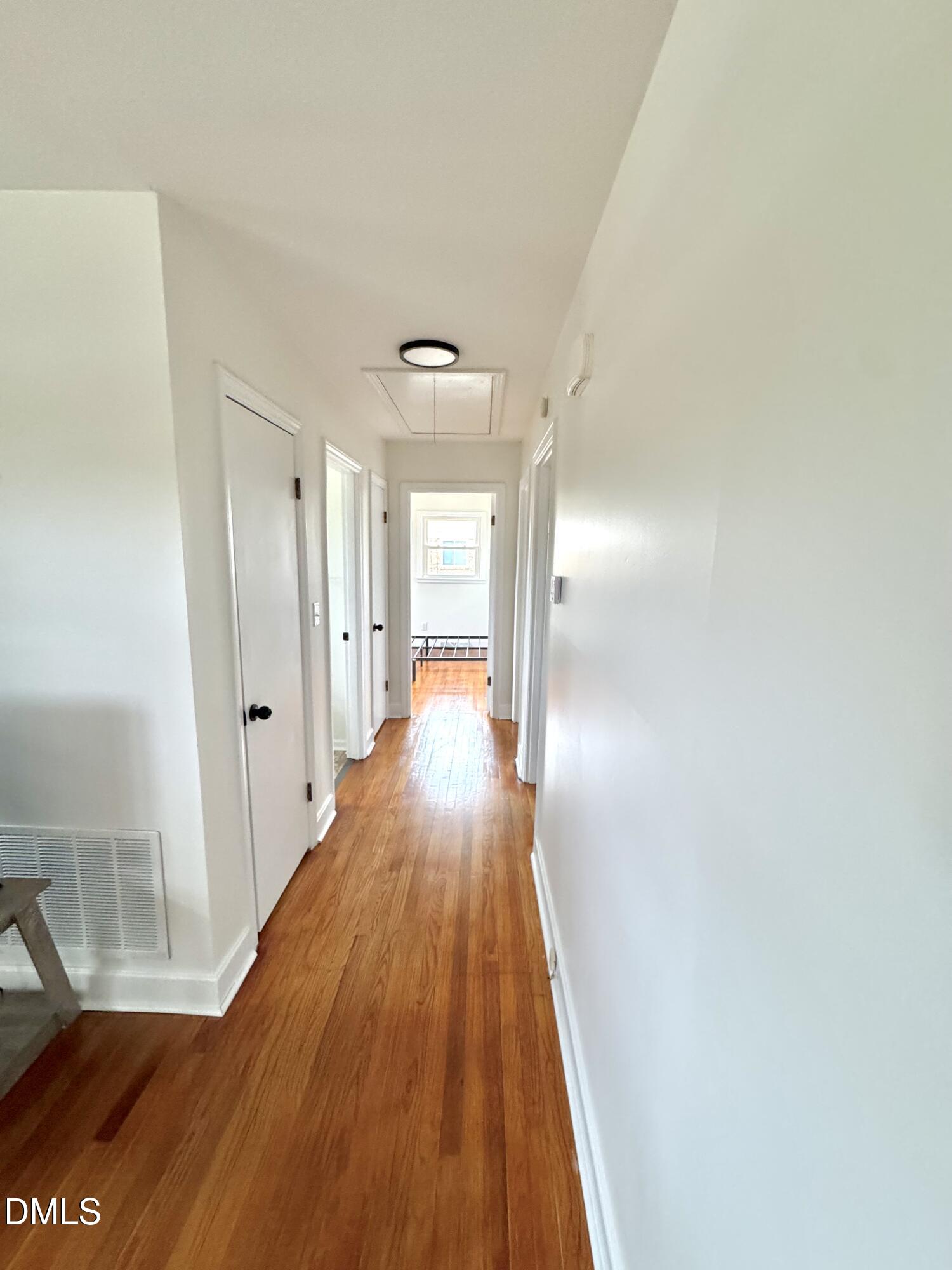 30 Nandina Drive Roxboro, NC 27573 - Photo 15 of 31 a view of a hallway with wooden floor