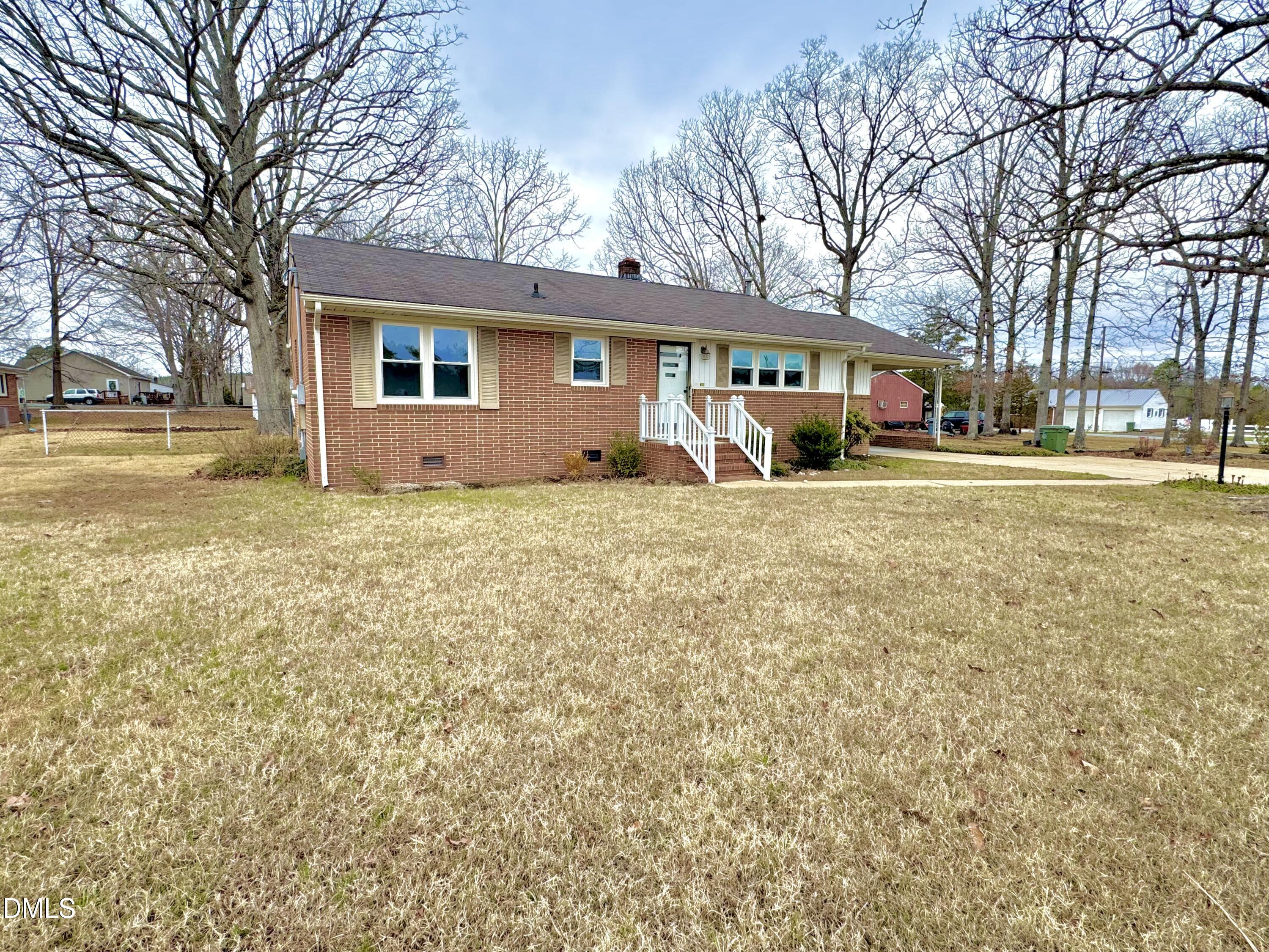 30 Nandina Drive Roxboro, NC 27573 - Photo 28 of 31 a front view of a house with a yard