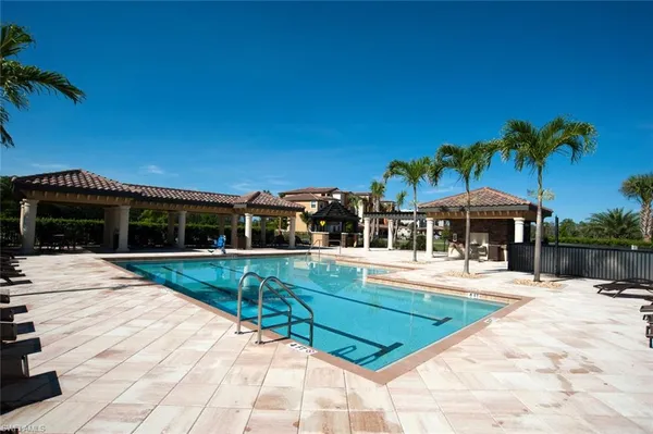 a view of a swimming pool with a patio