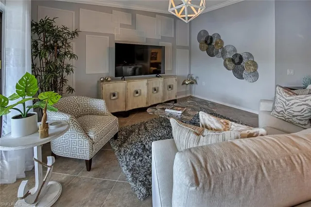 a bedroom with furniture and a potted plant