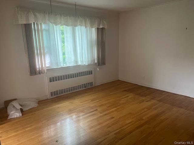 51-10 248th Street Queens, NY 11362 - Photo 4 of 8 a view of an empty room with a window