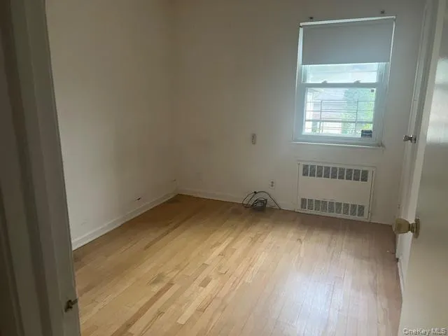 a view of an empty room and a window