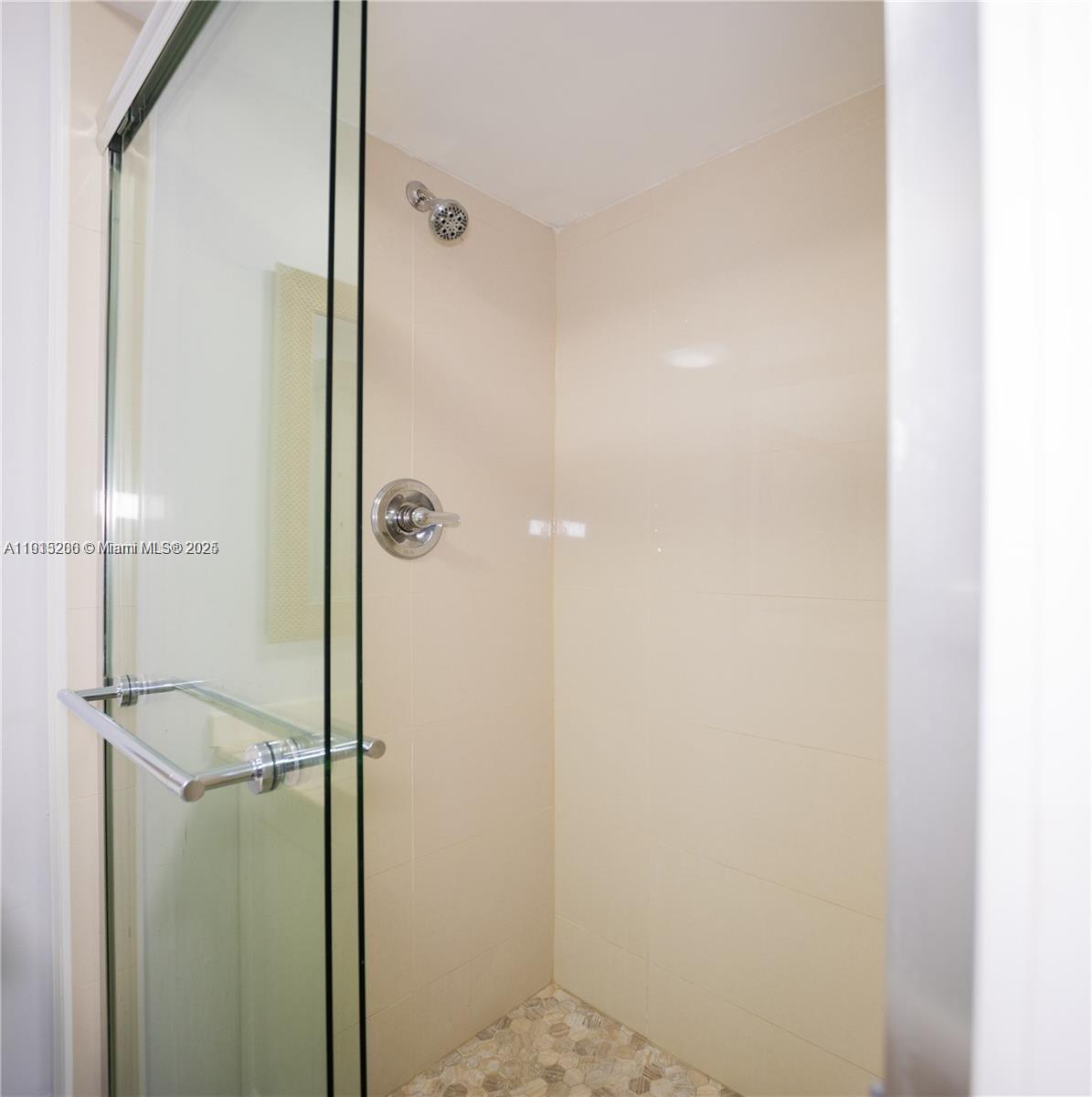 16100 Golf Club Road, Unit 202 Weston, FL 33326 - Photo 21 of 31 a bathroom with a shower
