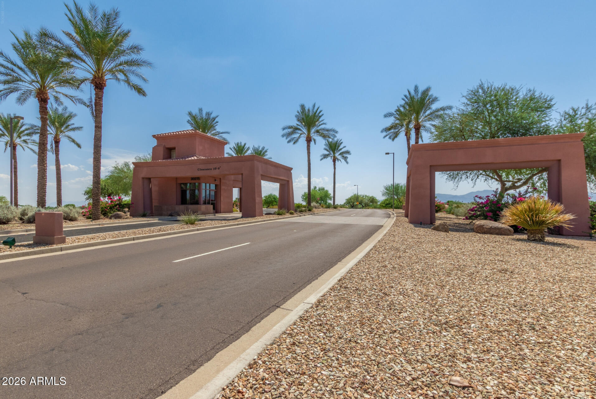 16731 West Oracle Rim Drive Surprise, AZ 85387 - Photo 27 of 54 a front view of a house with palm trees
