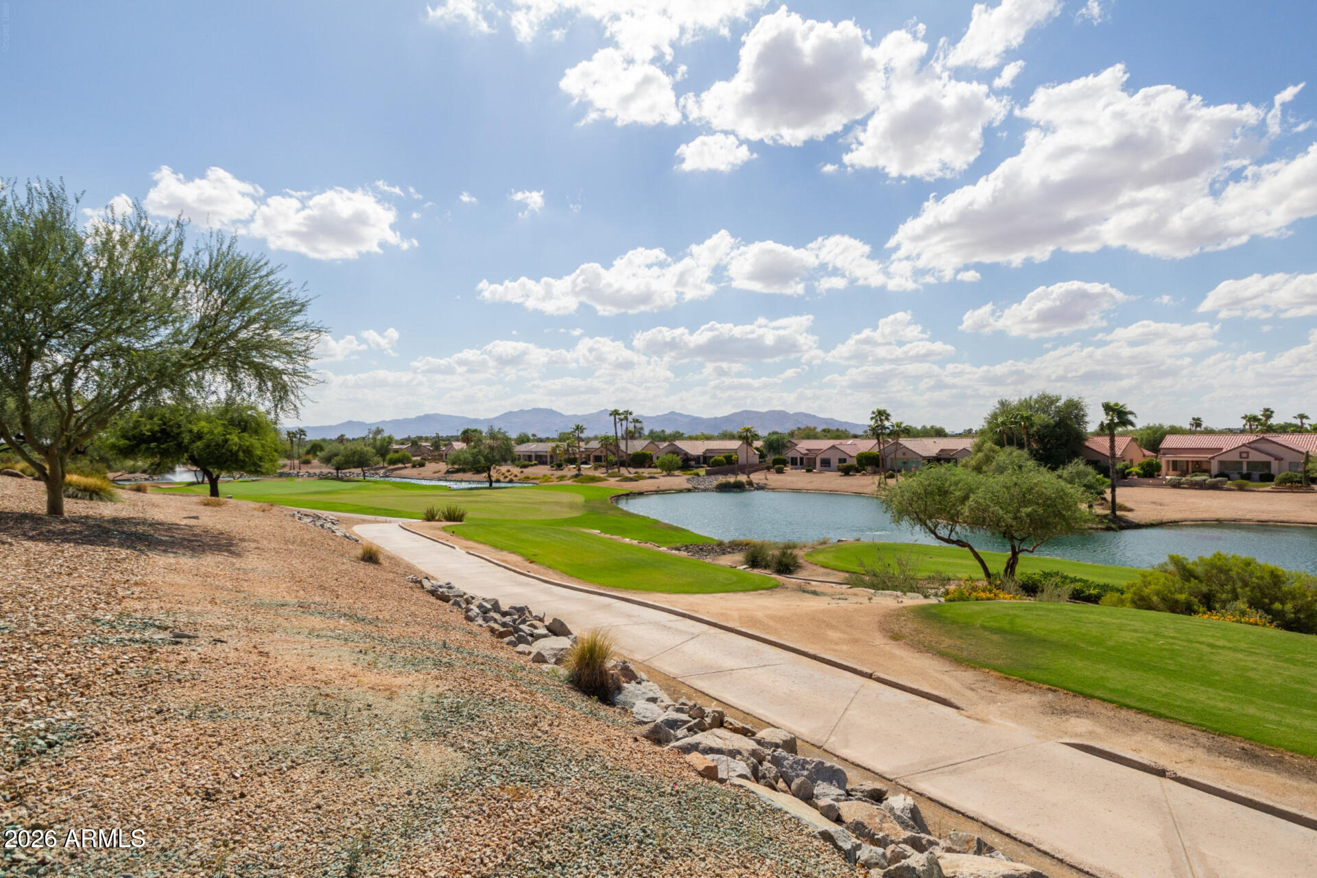 16731 West Oracle Rim Drive Surprise, AZ 85387 - Photo 41 of 54 a view of a lake with houses