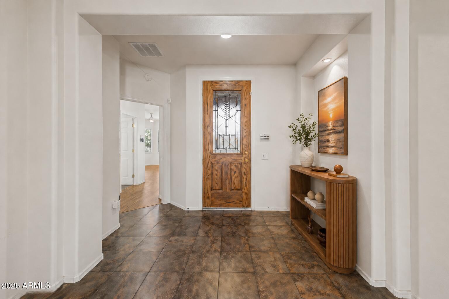 16731 West Oracle Rim Drive Surprise, AZ 85387 - Photo 5 of 54 a hallway with front door wooden floor