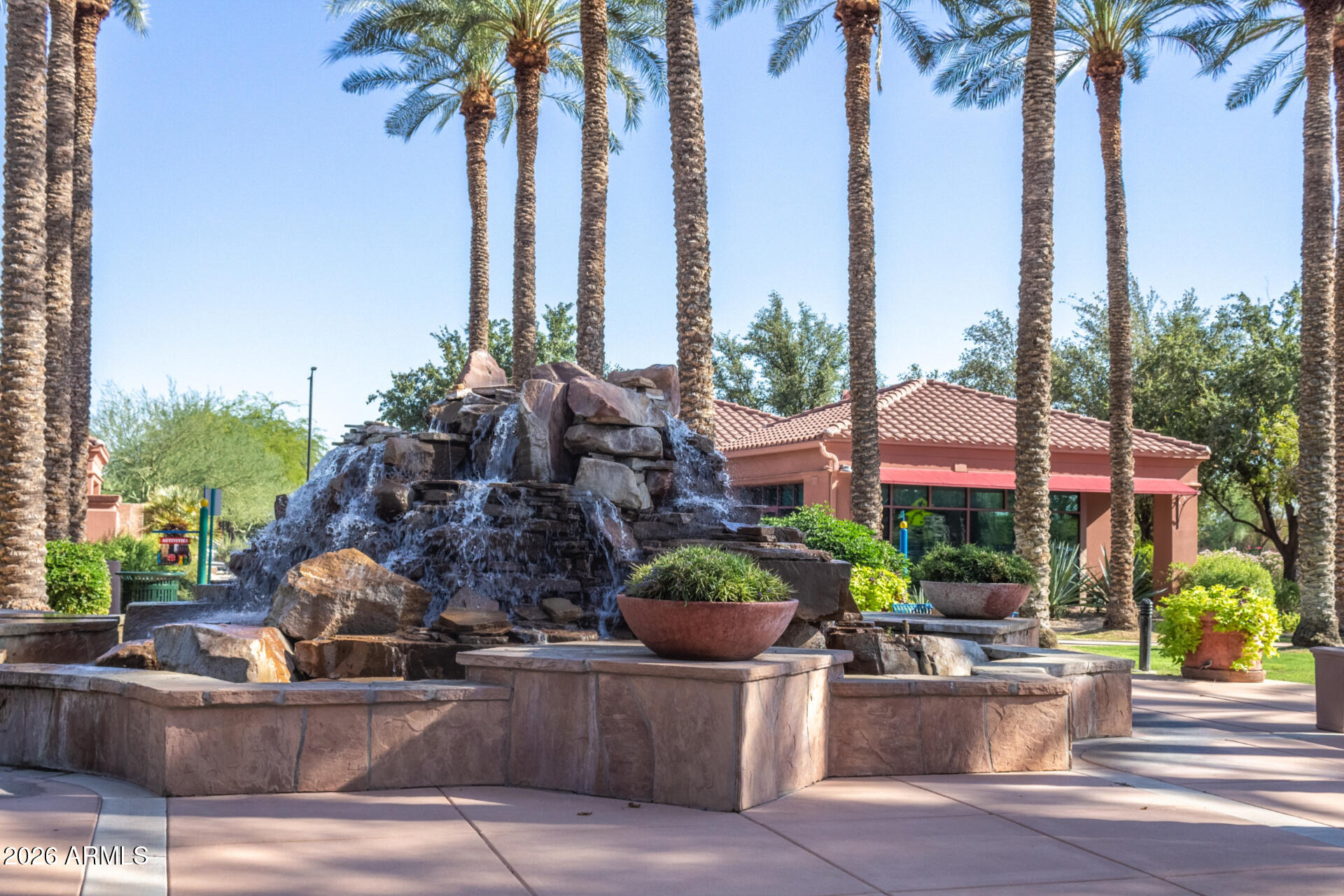 16731 West Oracle Rim Drive Surprise, AZ 85387 - Photo 53 of 54 a view of a house with a fountain and a garden