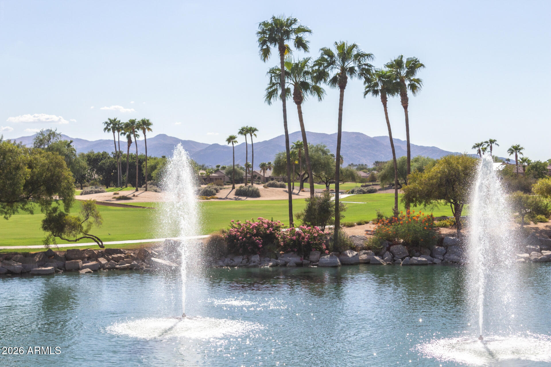 16731 West Oracle Rim Drive Surprise, AZ 85387 - Photo 54 of 54 a view of a lake with a big yard