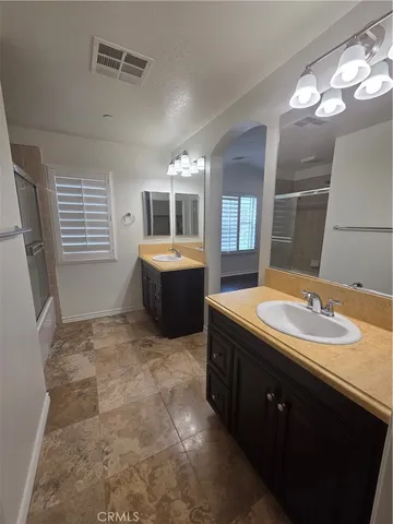 a bathroom with a tub and a shower